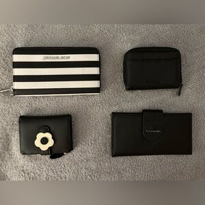 Group of four black leather wallets. Different brands and different sizes.  $40.